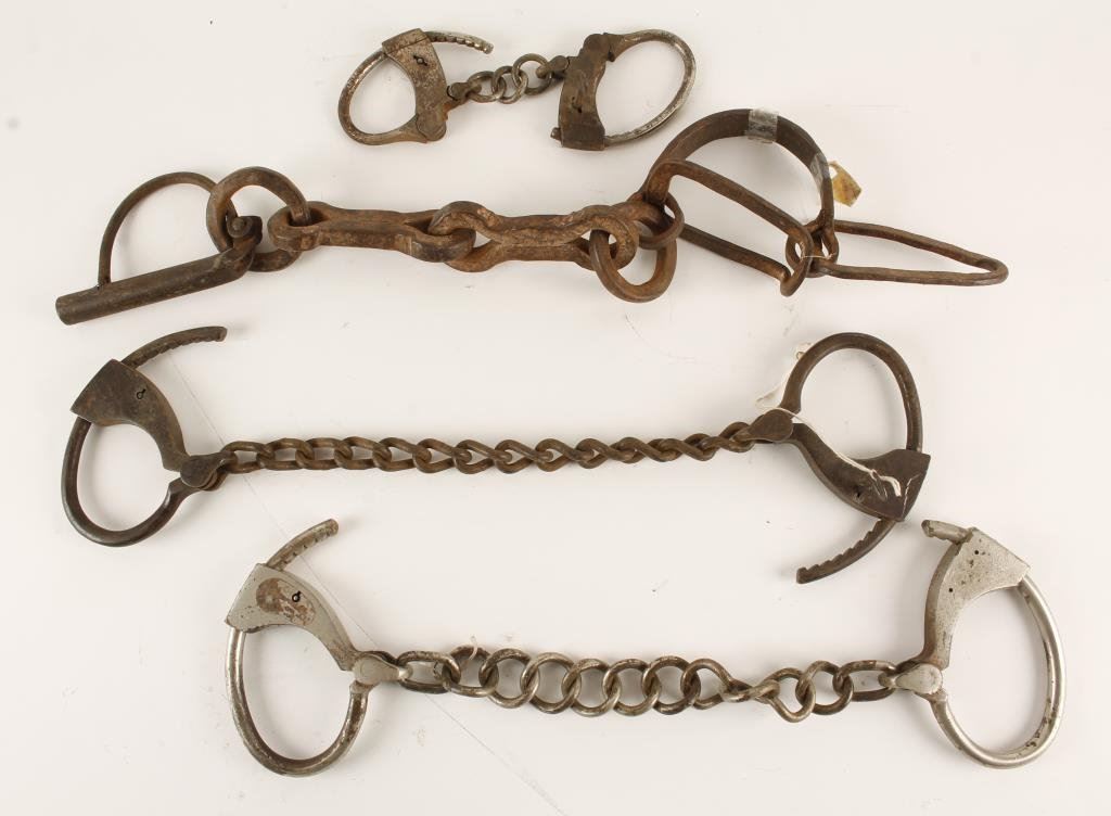 Lot of manacles and leg irons; one crude made 19th Century single leg; one
