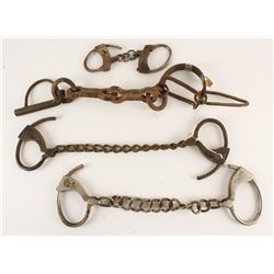 Lot of manacles and leg irons; one crude made 19th Century single leg; one