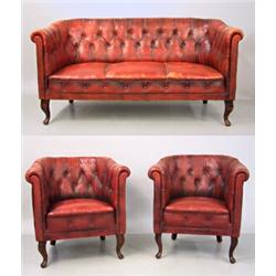 Salon group, 6 pieces, Red leather, 4 clubchairs, sofa and table, 1920s; table newer, wear, 2...