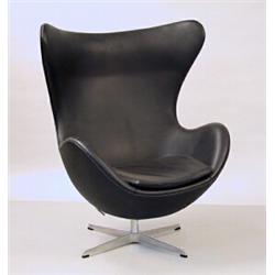 Easychair, Black leather designed by Arne Jacobsen, Denmark 1958, "Ägget", has never been used...