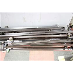 STACK OF METAL BED RAILS