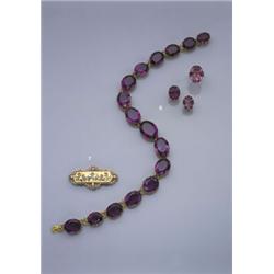 AN ANTIQUE AMETHYST RIVIERE NECKLACE CA 1890, Claw set with a graduated series of oval shaped ame...