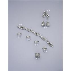 WOLFERS FRERES, A PAIR OF DIAMOND EARCLIPS, CA 1950, Each clip set with two principle brilliant-c...