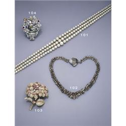 A GEM SET AND COLOURED DIAMOND GIARDINETTO BROOCH, The vase set with brilliant, baguette and rose...