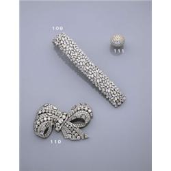 AN ART DECO DIAMOND, BOW BROOCH, Designed as a pave-set diamond ribbon bow with baguette-cut diam...