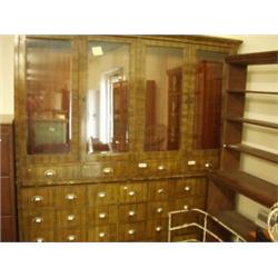 Mahogany shop fitment with bank of 28 drawers under glazed top, 81" wide x 85" high…