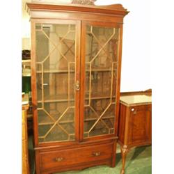 Mahogany glazed two door bookcase with bottom drawer and adjustable shelves, 44" wide…
