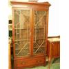 Image 1 : Mahogany glazed two door bookcase with bottom drawer and adjustable shelves, 44" wide…