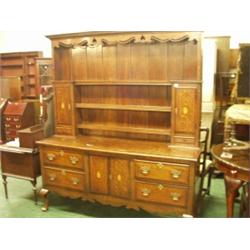 Good quality English oak dresser of four drawers united by finely pierced shaped apron with three…