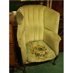 Georgian style wing armchair on ball and claw mahogany legs…