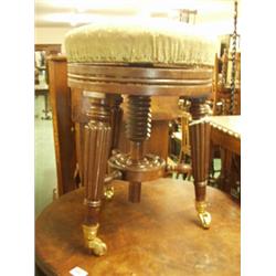 Early 19c adjustable piano stool in mahogany with fluted legs and later castors…