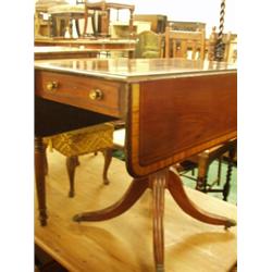 Late Georgian mahogany Pembroke table with crossbanded top on centre pedestal base and brass lion…