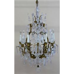 LOUIS XV STYLE GILT BRONZE AND GLASS SIX LIGHT CHANDELIER, 20th Century. The open lyre cage cen...