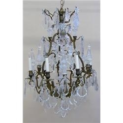 LOUIS XV STYLE GILT BRONZE AND GLASS SIX LIGHT CHANDELIER, 20th Century. The open lyre cage sup...