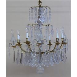 LOUIS XV STYLE GILT METAL AND GLASS EIGHT LIGHT CHANDELIER, The glass baluster standard support...