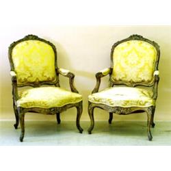 PAIR OF LOUIS XV STYLE CARVED AND GILTWOOD FAUTEUILS, French. 19th Century. Each leaf carved an...