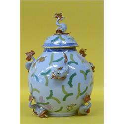 HEREND PORCELAIN JAR AND COVER WITH DOLPHINS, Hungarian. Shape No. 6419. In the "Poisson" patte...