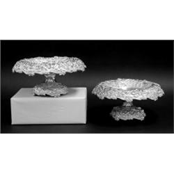 PAIR OF REPOUSSE STERLING SILVER COMPOTES, American. 1908-1915. Maker: Jenkins & Jenkins. Each...