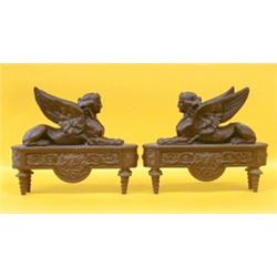 PAIR OF EMPIRE STYLE PATINATED BRONZE CHENETS, French. 19th Century. Each in the form of a wing...