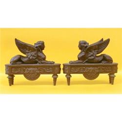 PAIR OF EMPIRE STYLE PATINATED BRONZE CHENETS, French. 19th Century. Each in the form of a wing...