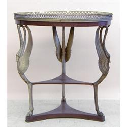 EMPIRE STYLE GILT BRONZE MOUNTED MAHOGANY GUERIDON, French. Circa 1900. The circular galleried...