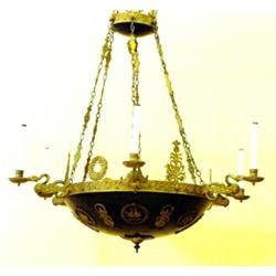 GOOD EMPIRE STYLE GILT AND PATINATED BRONZE SIX LIGHT CHANDELIER, French. 19th Century. The cir...