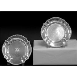 SET OF TWELVE TIFFANY & CO. STERLING SILVER BUTTER PLATES, American. 1891-1902. Each centered b...