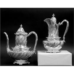 TIFFANY & CO. STERLING SILVER COFFEE POT AND HOT MILK JUG, American. 1891-1902. Each with wavy...