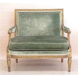 PAIR OF LOUIS XVI STYLE CARVED AND GILTWOOD MARQUISES, French. 19th Century. Each upholstered b...