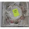 Image 1 : SILVER CHARM PINK ASSORTED CHARMS BRACELET