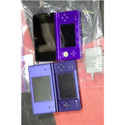 PAIR OF NINTENDO DS WITH 2 GAMES AND 1 CHARGER