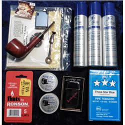 To be sold on the floor only.  A Group of Smoking supplies from the Estate.  Includes Pipe, lighter,