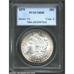 1879 $1 MS65 PCGS. A lustrous Gem that is brilliant aside from a blush of rose-violet color near...