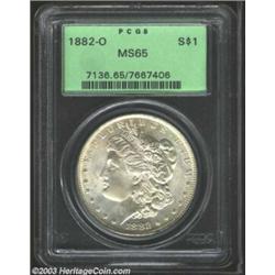 1882-O $1 MS65 PCGS. Softly lustrous, with satiny pastel toning on both sides. There are just a f...