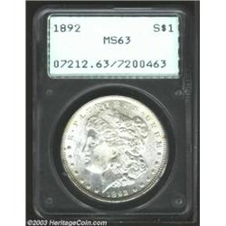 1892 $1 MS63 PCGS. Lustrous, brilliant, and well struck with refreshingly clean fields and a few...
