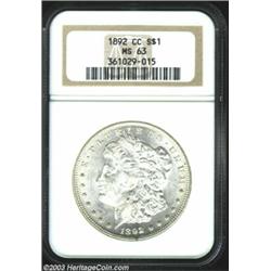 1892-CC $1 MS63 NGC. Lots of eye appeal for the grade with bright, frosty luster and a generally...