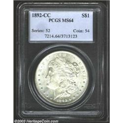 1892-CC $1 MS64 PCGS. Softly struck with clean fields, which are somewhat subdued by milky patina...