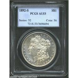 1892-S $1 AU53 PCGS. Traces of prooflike luster glimmer from the peripheries. Suggestions of milk...
