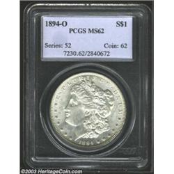 1894-O $1 MS62 PCGS. Essentially brilliant with semi-prooflike fields and satiny luster, there ar...