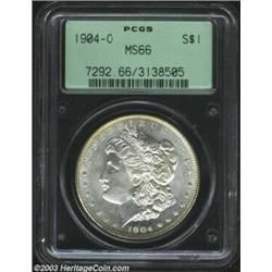 1904-O $1 MS66 PCGS. A sharply struck Gem with good luster and wispy tan-gray patina. The surface...