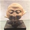 Image 1 : A STONE HUMAN HEAD SCULPTURE