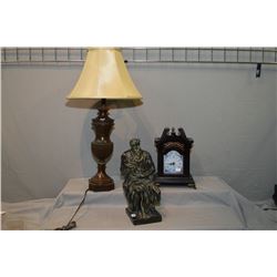 A simulated bronze urn style table lamp, a Devonware bronze style sculpture and a modern quartz mant