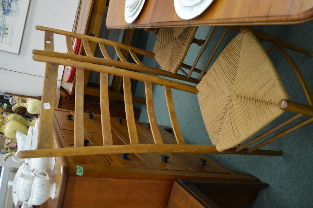 Four antique Quebec pine ladder back chairs with rush seats and table