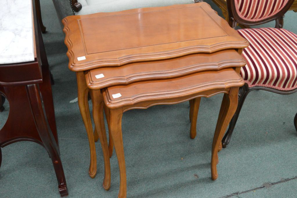 Set of three walnut French Provincial style nesting tables