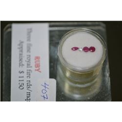 Three royal fire ruby gemstones including rounds and marquise, appraised value $1,150.00