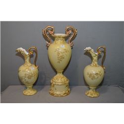 A four piece unmarked semi-porcelain mantle set including two handled ewers and a double handled cen