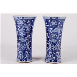 [CHINESE] A PAIR OF CHINESE 19TH CENTURY BLUE AND WHITE PORCELAIN VASES DECORATED WITH DUELING DRAGO