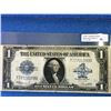 Image 1 : USA; $1.00 note 1923 T77701088D Silver Dollar, Fine with light tear in bottom center fold.