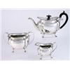 Image 1 : A George V three piece oval teaset, beaded border, melon lobed body, scrolled handle, on four paw...