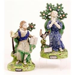 A pair of Staffordshire pearlware figures of St Peter and St Paul, circa 1810, both seated before...